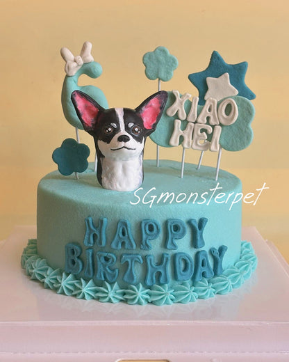 Blue birthday pet cake with a dog topper and 'Happy Birthday' wording