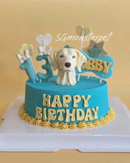 Blue birthday pet cake with a dog figurine and wording.