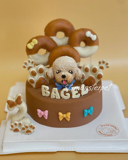 Dog-themed birthday pet cake with donuts and a small dog figurine.
