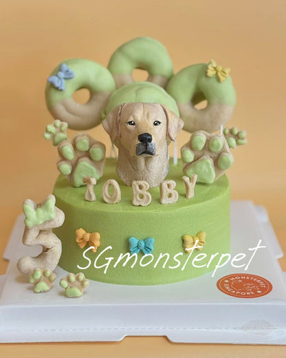 Pet cake with a dog figurine and decorative elements