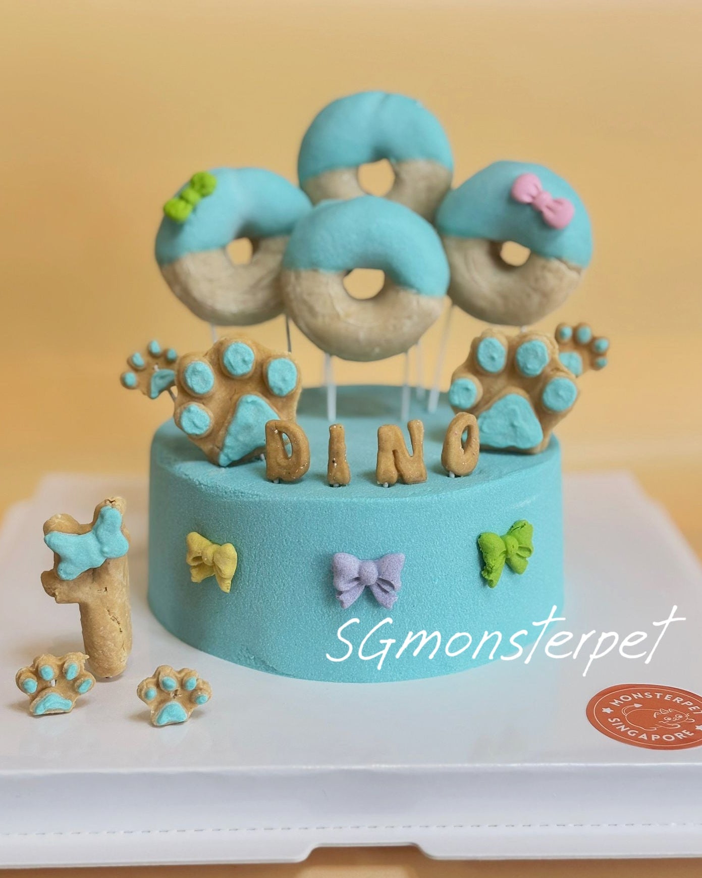 Blue pet cake with donut-shaped decos