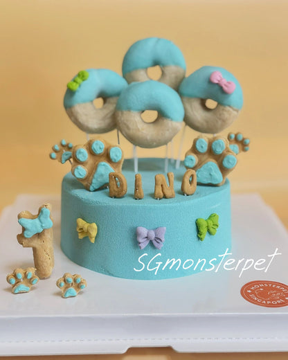 Blue pet cake with donut-shaped decos