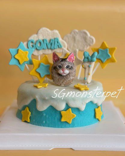 Pet cake with a cat figurine and star decorations