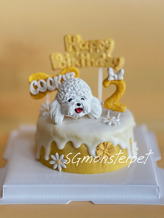 Dog-themed birthday pet cake with a toy poodle and 'Happy Birthday' topper on a yellow background.