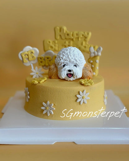 Yellow pet cake with a dog figurine and 'Happy Birthday' topper on a white stand.
