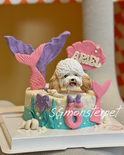 Decorative pet cake with a mermaid-themed design featuring a small dog figure