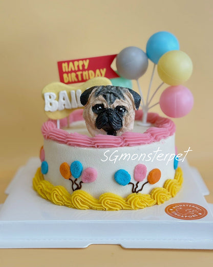 Birthday pet cake with a pug figurine and colorful balloons