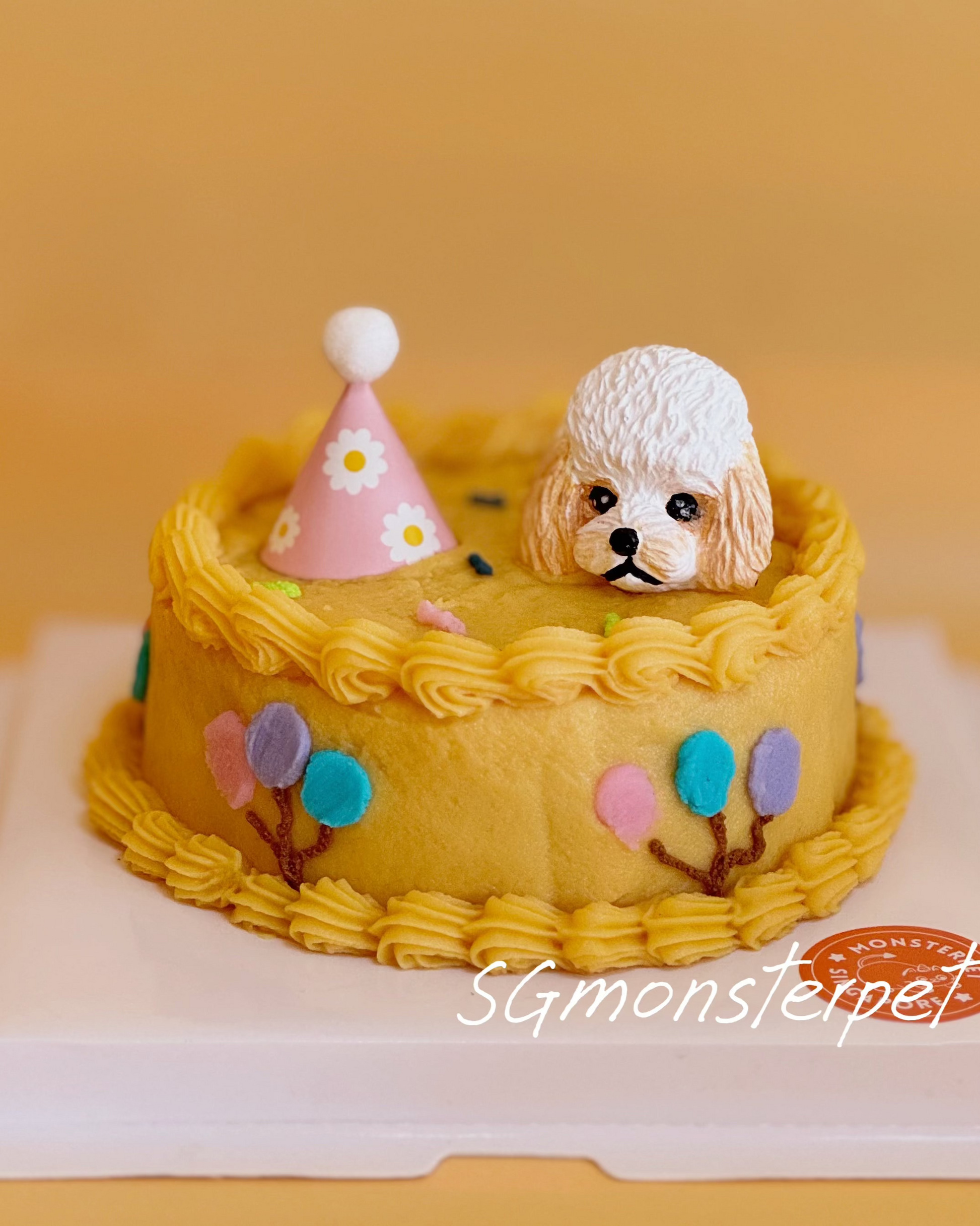 Pet cake with a dog figurine and party hat