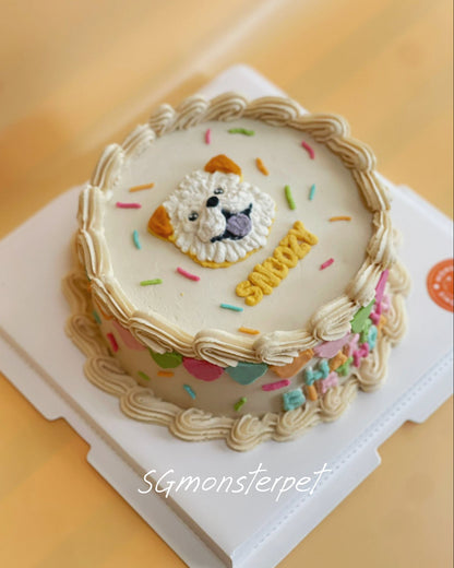Decorative pet cake with a lion face design and colorful sprinkles on a white stand.