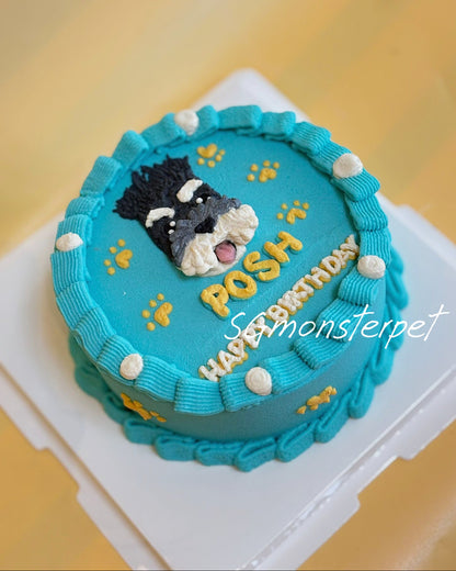 Blue pet cake with a dog figurine and name.