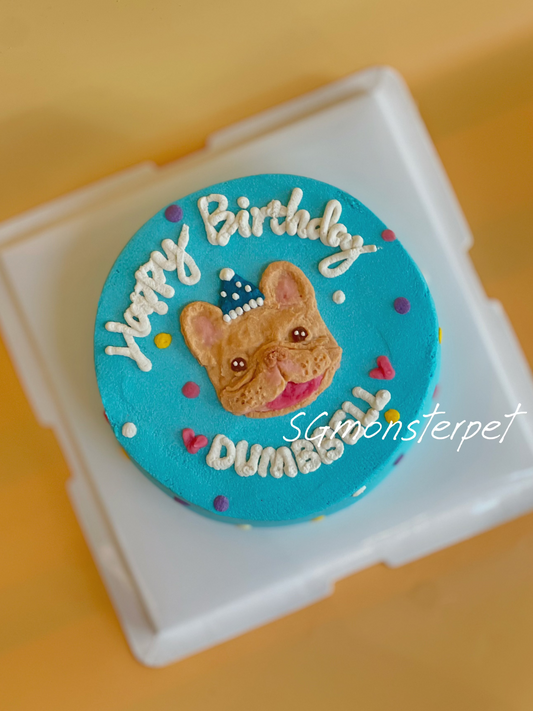Round blue birthday pet cake topper with a dog's face and 'Happy Birthday' text.