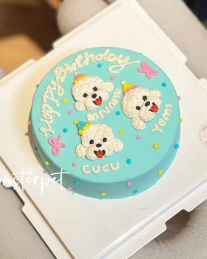 Small round pet cake with cartoon dog designs and 'Happy Birthday' text.