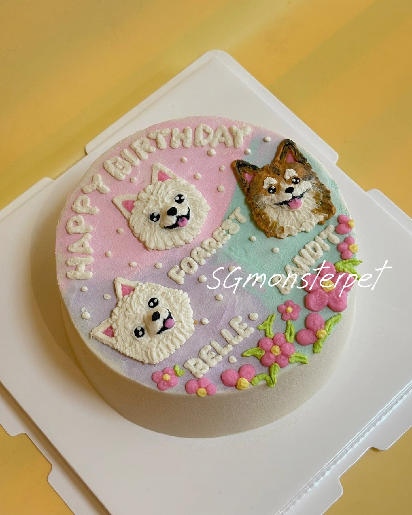 Dog-themed birthday pet cake with three dog faces on a yellow background