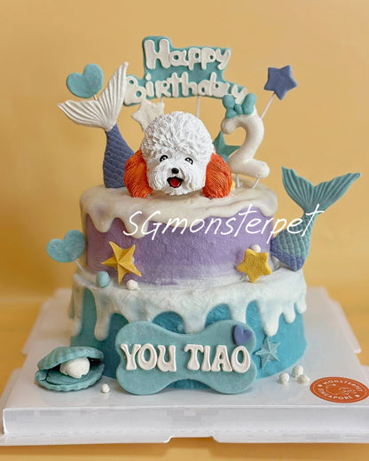 Two-tier birthday pet cake with mermaid-themed decorations