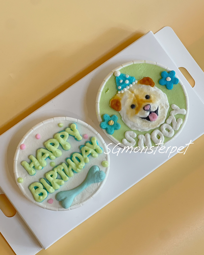 Two dog-themed birthday cake toppers on a white box with 'Happy Birthday' and 'Snoopy' text.