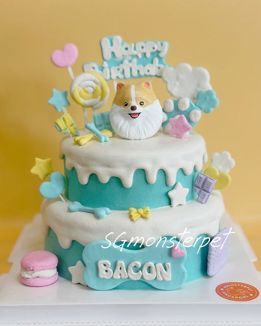 Two-tier birthday pet cake with dog figurine, 'Happy Birthday' topper